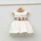 Vestido bebés Emma con fajín de lino y adorno floral